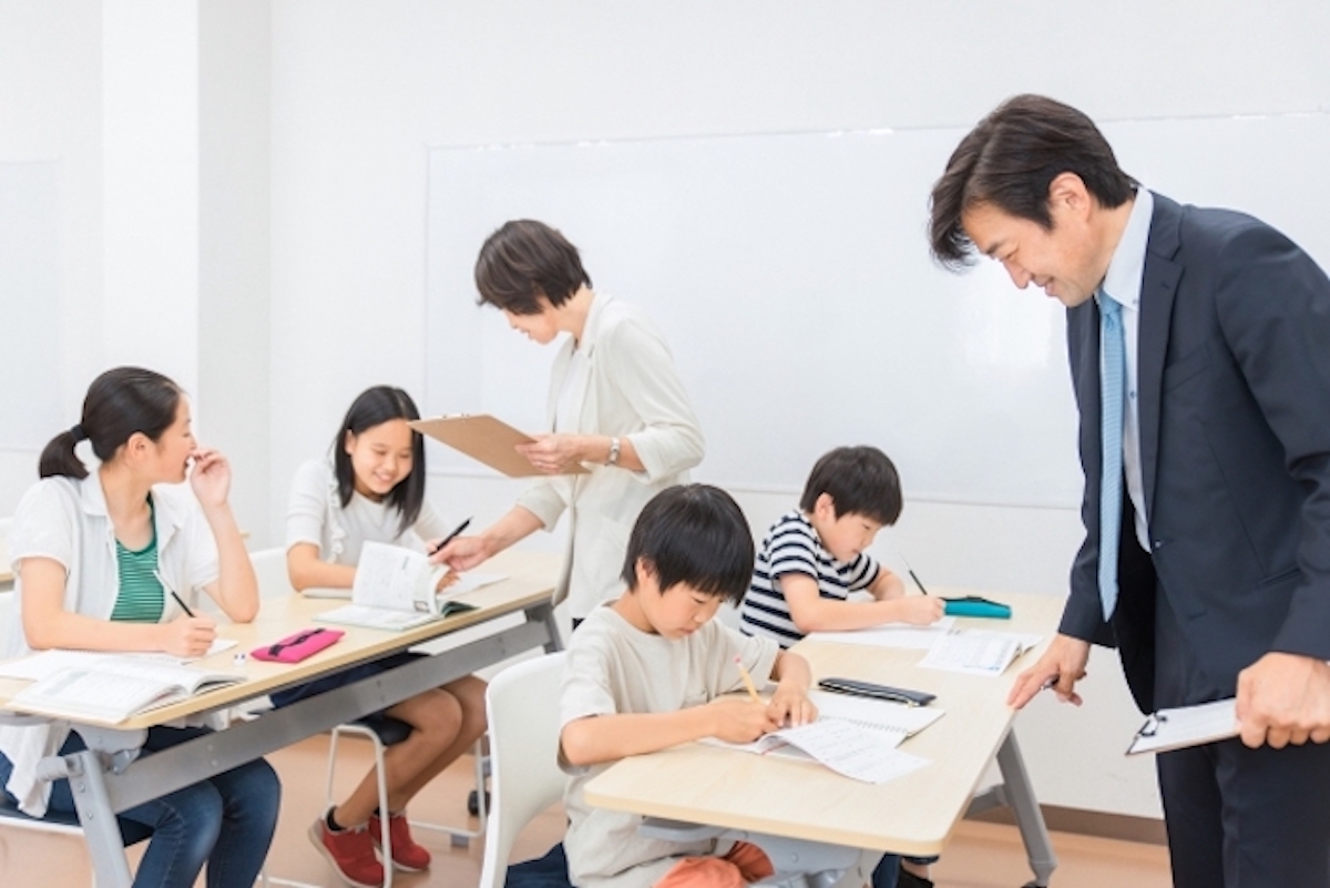 Teacher and children with learning disabilities